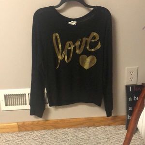 Black sweater that says love